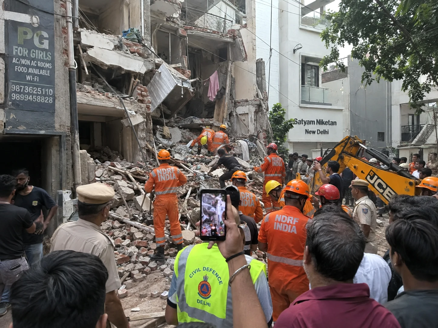 Rescue personnel at the site of the collapsed PG building in Delhi’s Satya Niketan near Delhi University South Campus